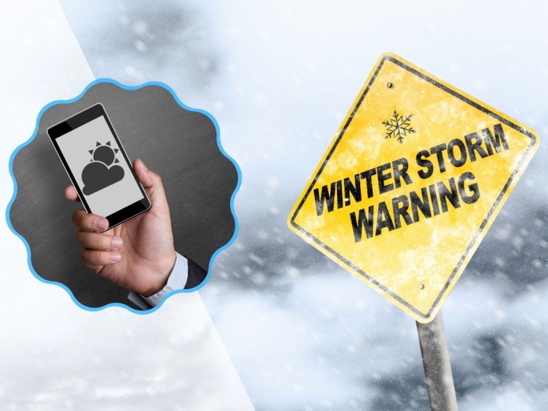 Winter Warnschild und eine Wetter-App