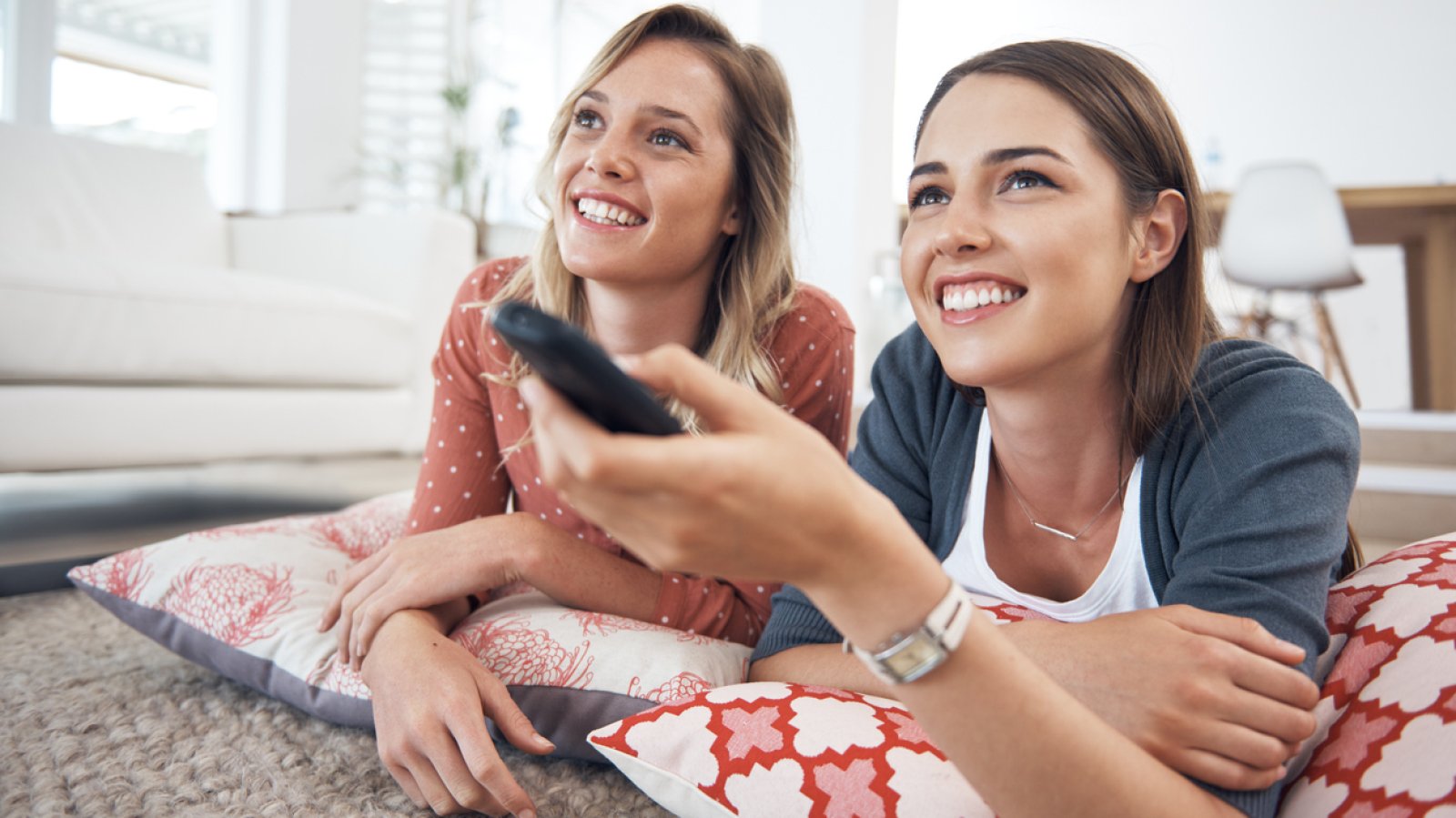 5 полезных. Two young women watching TV.